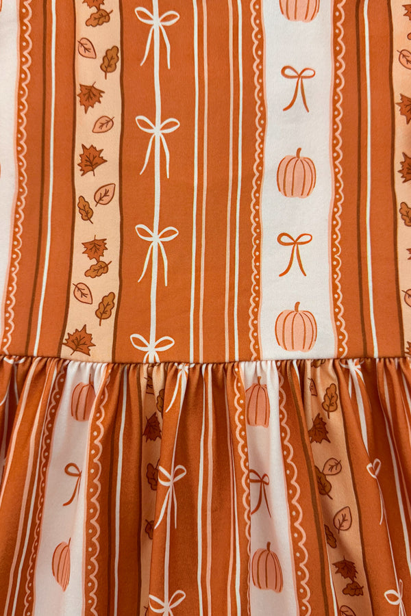 Pumpkins & Bows Stripe Dress - 6-12 Months - Orange and cream striped dress with pumpkin and bow patterns, gathered waist, lightweight fabric.