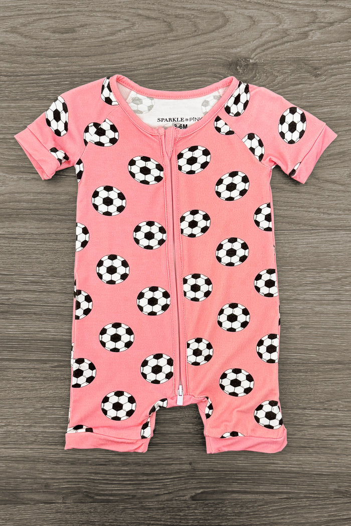 Pink Bamboo Soccer Ball Onesie - Newborn - Pink short-sleeve baby onesie with black and white soccer ball print and snap buttons at the bottom.