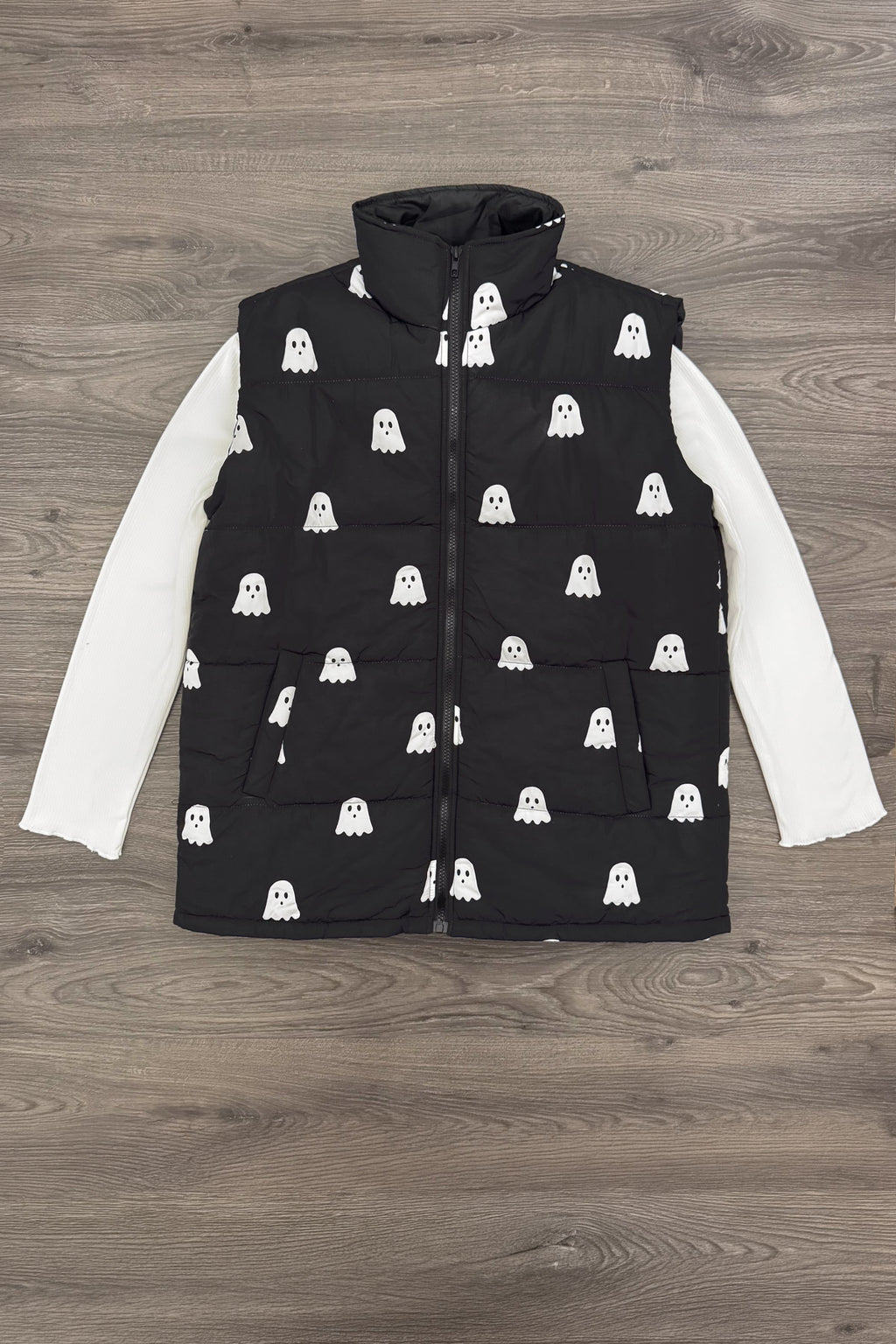 Mom & Me - Ghost Vest Set - MOM-XS - Black sleeveless puffer vest with white ghost print over a long-sleeve white shirt on wood floor background.