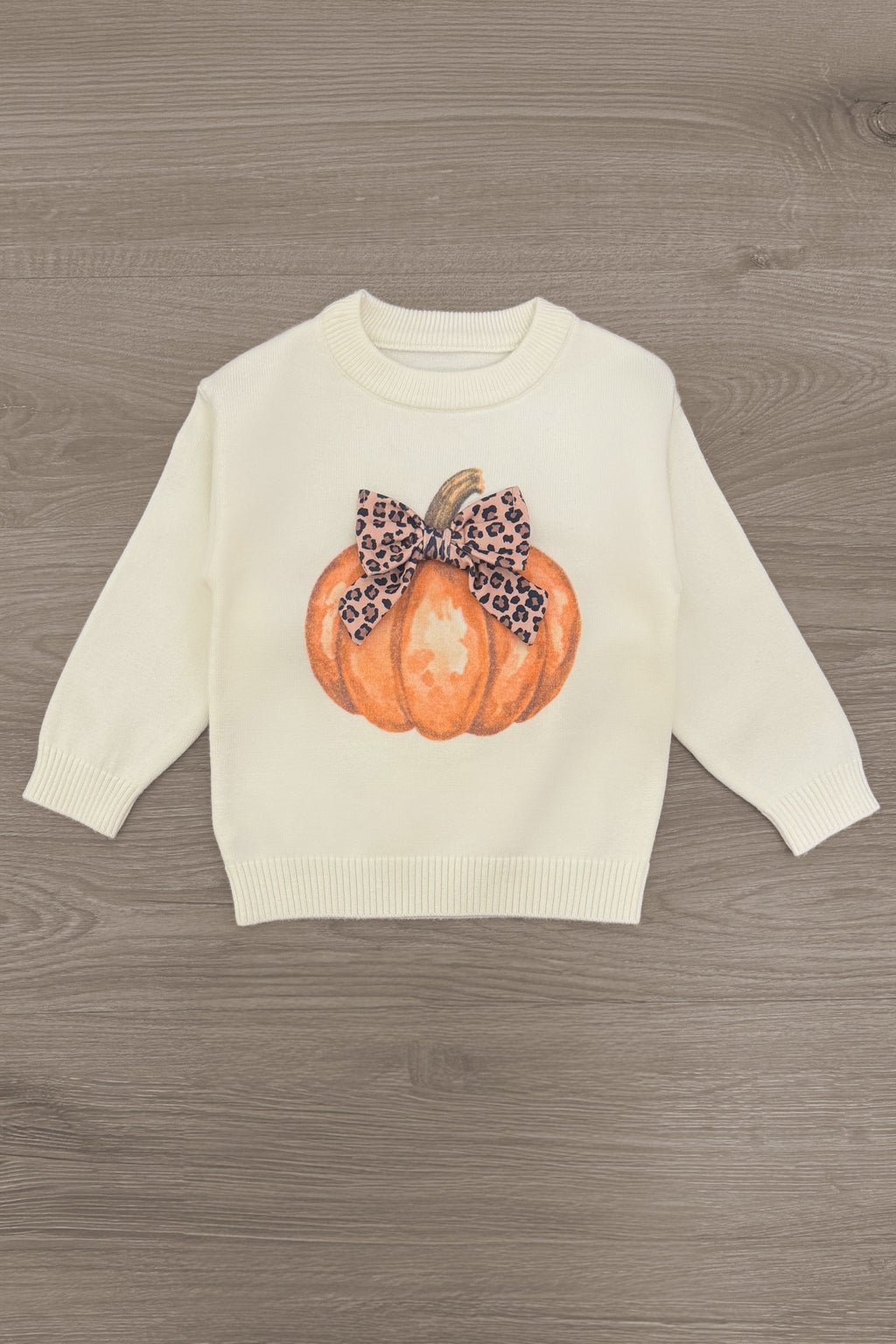 Cheetah Pumpkin Velvet Flare Set - 6-12 Months - Cream sweatshirt with a large orange pumpkin graphic topped with a brown cheetah print velvet bow.