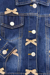 Plaid Bow Denim Jacket - 6-12 Months - Blue denim jacket with white buttons and small beige plaid bow accents on pockets and button placket.