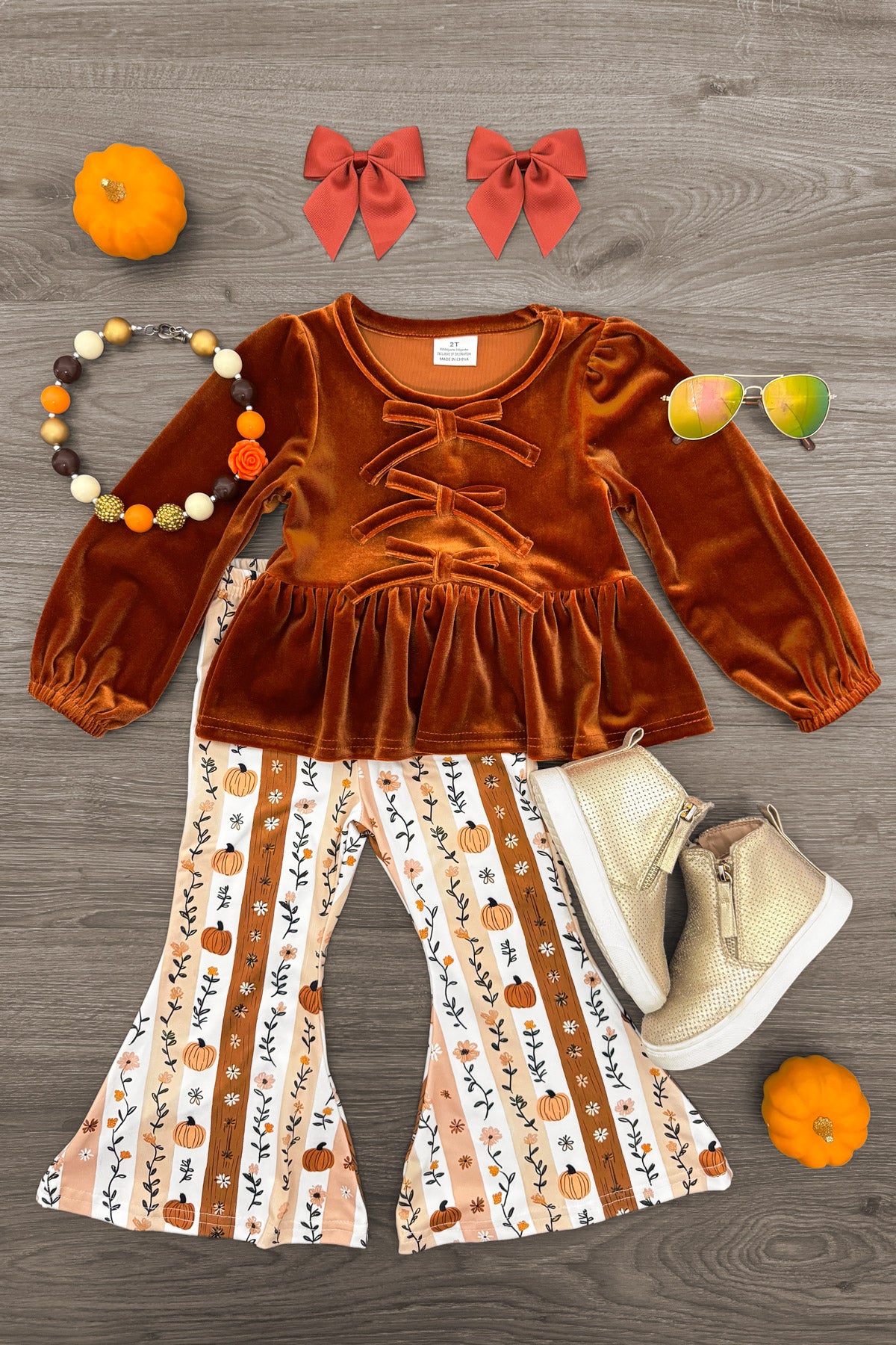 Floral Pumpkin Velvet Flare Set - 6-12 Months - Rust velvet long-sleeve top with ruffle waist paired with cream floral striped bell-bottom pants.