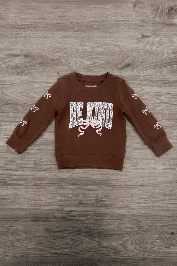 "Be Kind" Cheetah Denim Bell Bottom Set - 6-12 Months - Brown long-sleeve sweatshirt with "BE KIND" text in white cheetah pattern and cheetah paw prints down the sleeves.