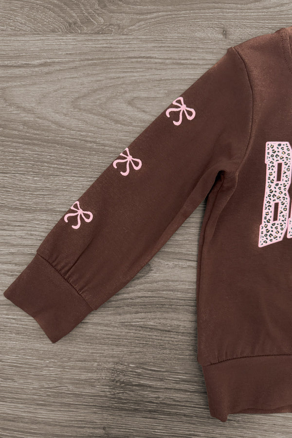 "Be Kind" Cheetah Denim Bell Bottom Set - 6-12 Months - Brown denim bell bottom set top with pink cheetah print bows on the sleeve and block letter "B" on the chest.