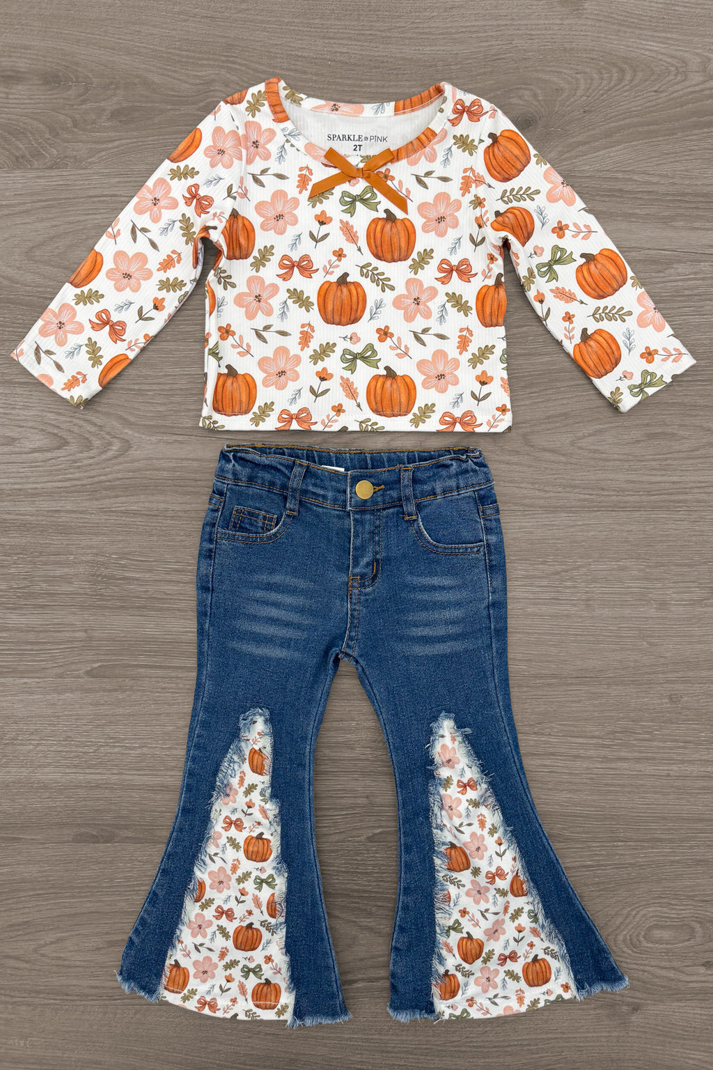 Pumpkins & Bows Flare Denim Pant Set - 6-12 Months - Long-sleeve white top with orange pumpkin and leaf print and orange bow neckline paired with blue flare denim pants.