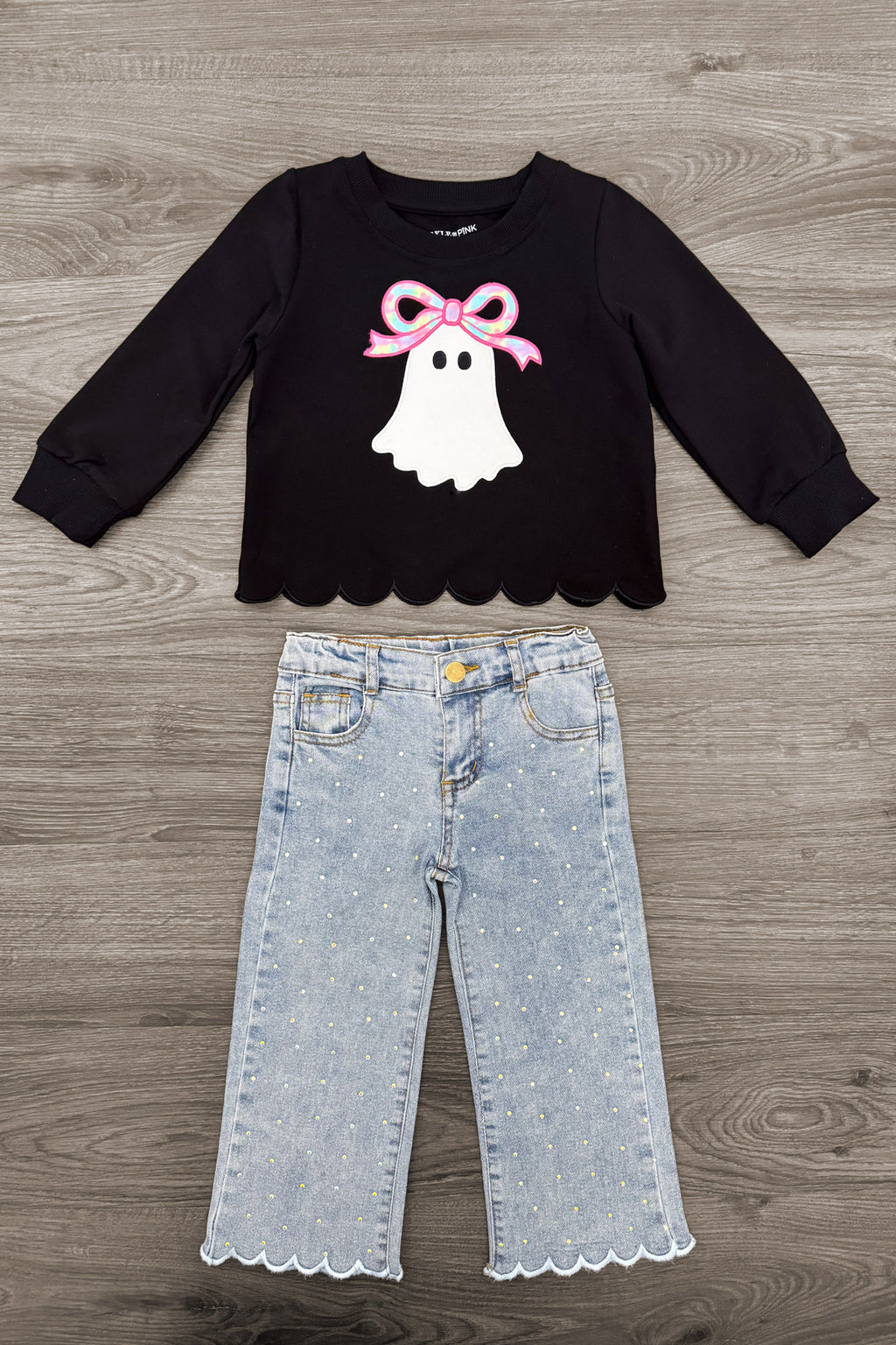 Rhinestone Ghost Denim Pant Set - 6-12 Months - Black long-sleeve top with scalloped hem and pink-bow ghost graphic, paired with light-wash scalloped-hem denim pants.