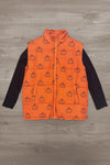 Mom & Me - Pumpkin Vest Set - MOM-XS - Orange quilted vest with black pumpkin prints over a black long-sleeve shirt on wooden floor background.
