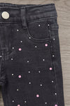 "For Complaints About Attitude.." Denim Pant Set - 6-12 Months - Black denim pants featuring small pink and white rhinestone embellishments scattered across the front pocket area.