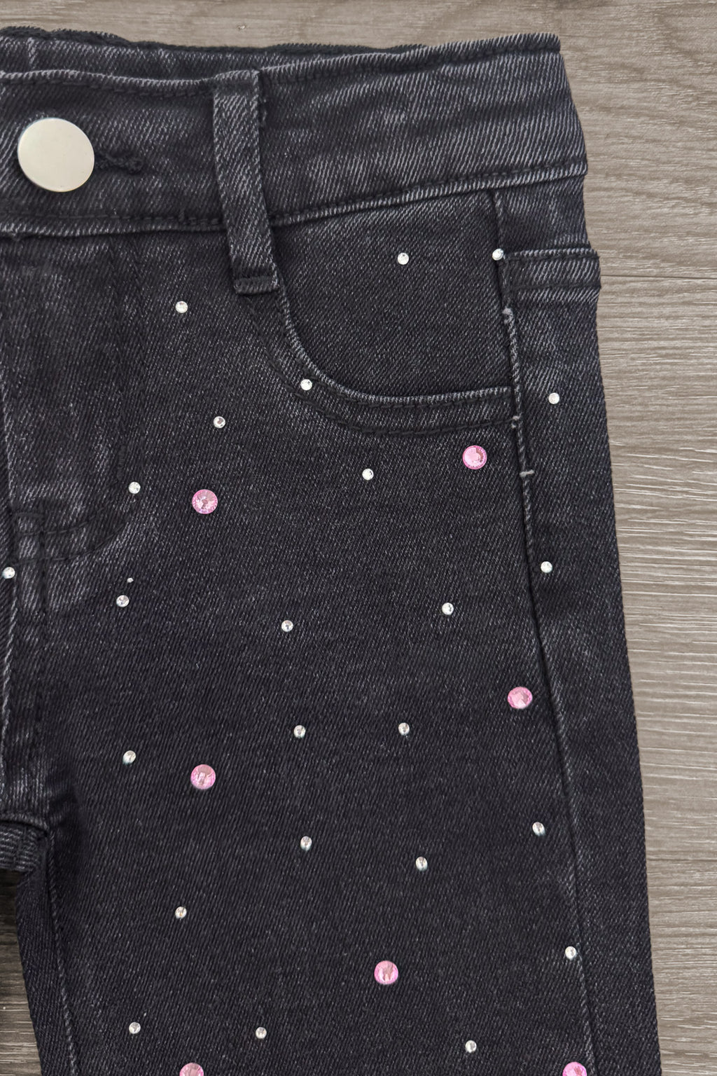 "For Complaints About Attitude.." Denim Pant Set - 6-12 Months - Black denim pants featuring small pink and white rhinestone embellishments scattered across the front pocket area.