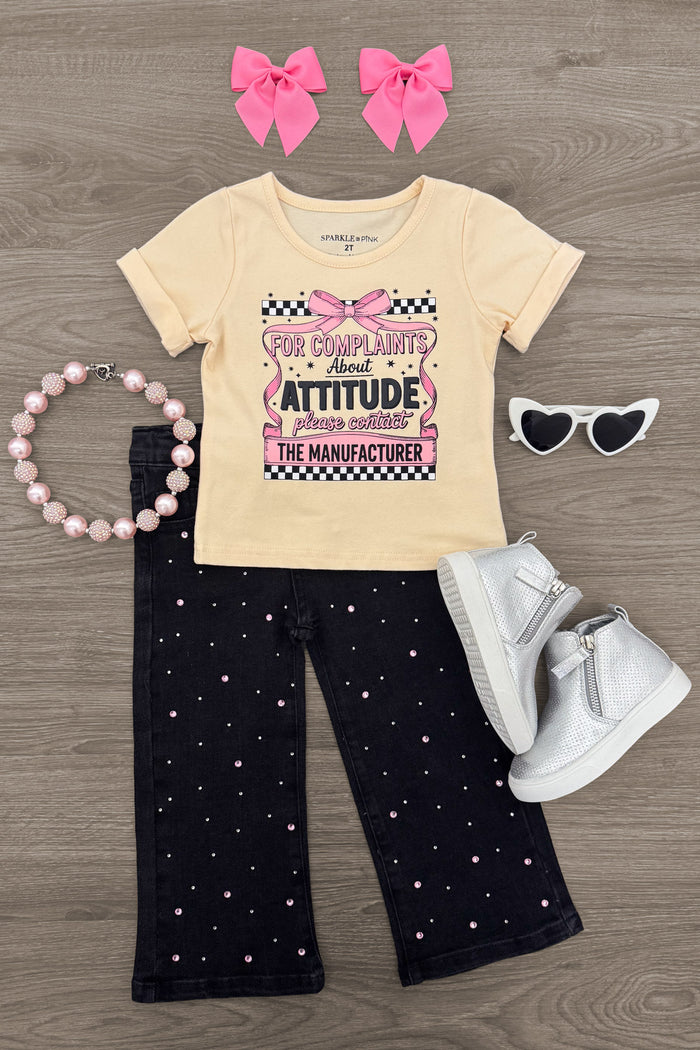 "For Complaints About Attitude.." Denim Pant Set - 6-12 Months - Cream short-sleeve graphic tee with colorful text and black wide-leg denim pants with small white and pink hearts, paired.