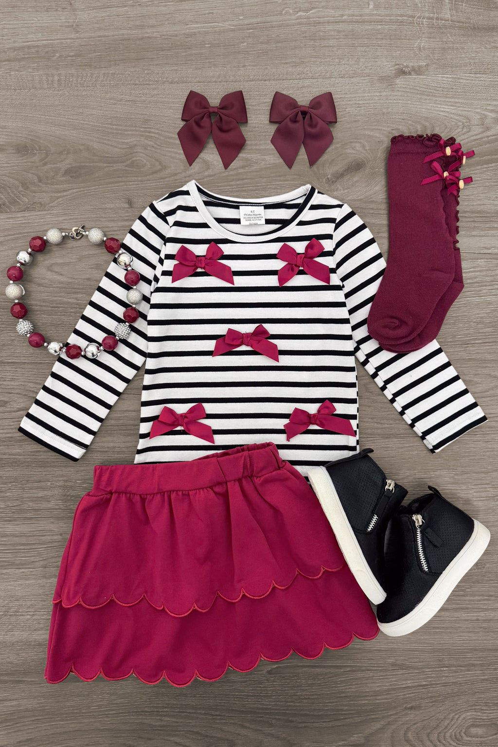 Striped Burgundy Bow Skirt Set - 6-12 Months - Burgundy and white striped long-sleeve top with burgundy bows, scalloped burgundy skirt, matching burgundy knee socks, bow.
