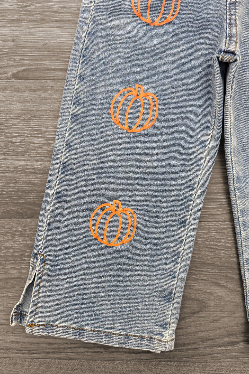 "Take Me To The Pumpkin Patch" Denim Pant Set - 6-12 Months - Light wash denim pants with orange pumpkin embroidery along the leg and frayed hems.