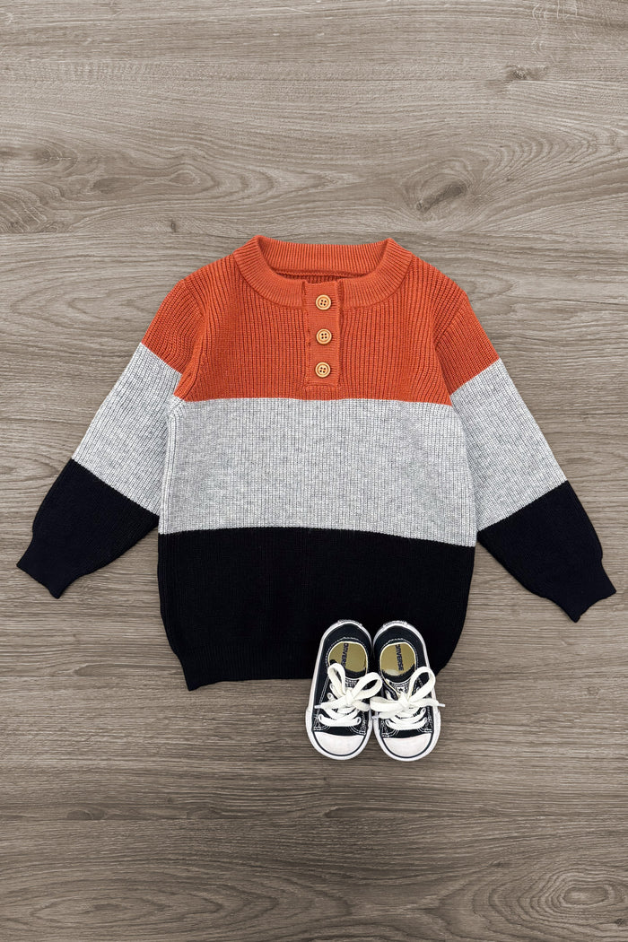Rust Colorblock Sweater - 6-12 Months - Rust orange, gray, and black colorblock knit sweater with three wooden buttons on the neckline and long sleeves.