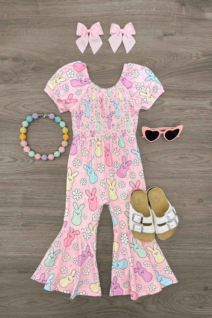 Pastel Peep Bunny Jumpsuit - 3XS-6-12 Months - Pastel pink baby jumpsuit with colorful bunny prints, puff sleeves, ruffled bell-bottom legs, paired with matching pink.