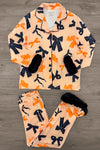 Mom & Me - Fuzzy Orange & Black Bow Pajamas - MOM-XS - Fuzzy orange pajama set with black and dark blue bow patterns, black faux fur cuffs on sleeves and pant legs.