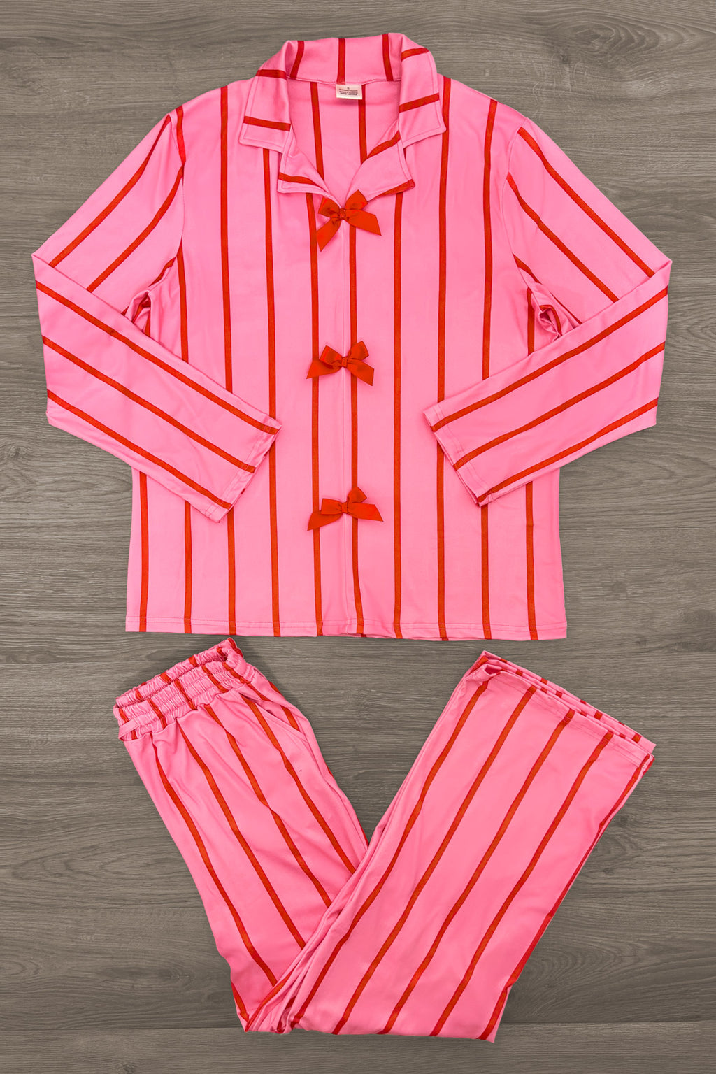 Mom & Me - Pink & Red Stripe Bow Pajamas - MOM-XS - Pink long-sleeve pajama set with vertical red stripes and three red bow accents on the top.