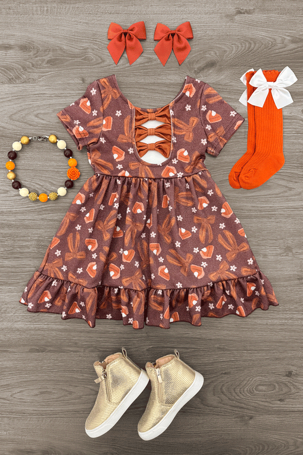 Pumpkin Pie Glitter Dress - 6-12 Months - Brown short-sleeve dress with pumpkin and leaf print, lace-up front, and ruffled hem.