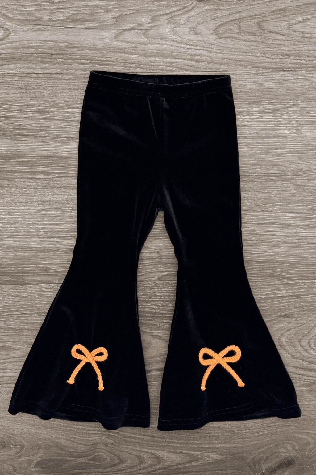 Jack O' Lantern & Bows Velvet Flare Set - 6-12 Months - Black velvet flared pants with orange bow appliques near the hem.