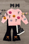 Jack O' Lantern & Bows Velvet Flare Set - 6-12 Months - Pink velvet long-sleeve top with colorful Jack O' Lantern faces and black bow designs, paired with black velvet flare.