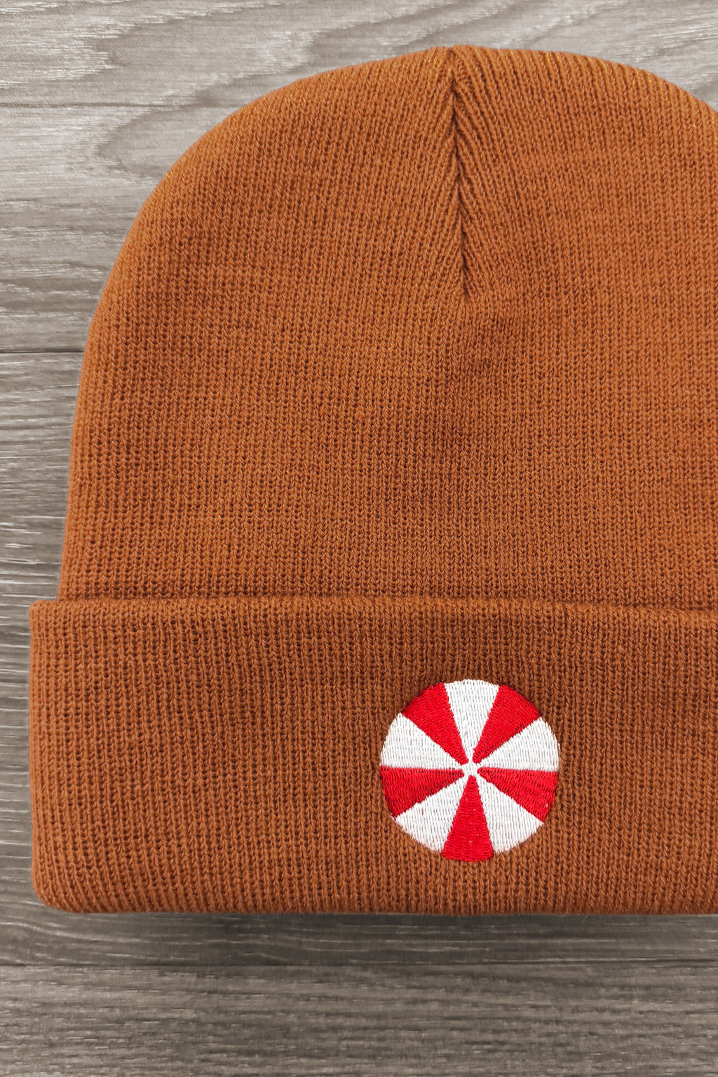 Gingerbread Beanie - 6-12 Months - 4T - Rust-orange knit beanie with folded cuff and red-and-white peppermint candy patch on front.