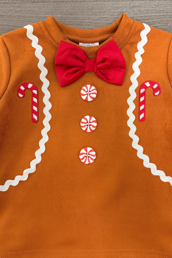 Gingerbread Man Costume - 6-12 Months - Brown gingerbread man costume with white icing trim, candy cane patches, red bow tie, and three round peppermint buttons.