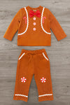 Gingerbread Man Costume - 6-12 Months - Orange long-sleeve top and pants set with gingerbread man design, white icing trim, red bow tie, and peppermint candy.