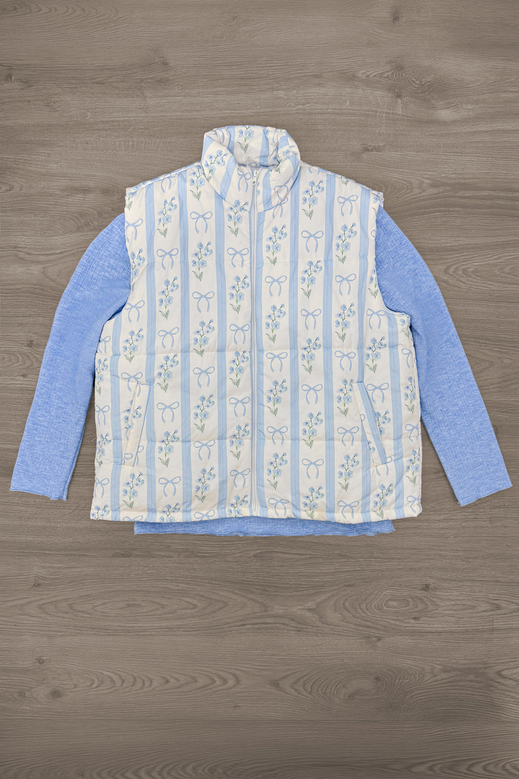 Mom & Me - Blue & White Floral Bow Vest Set - MOM-XS - Blue long-sleeve shirt paired with a sleeveless white vest featuring blue floral stripes and a front zipper closure.