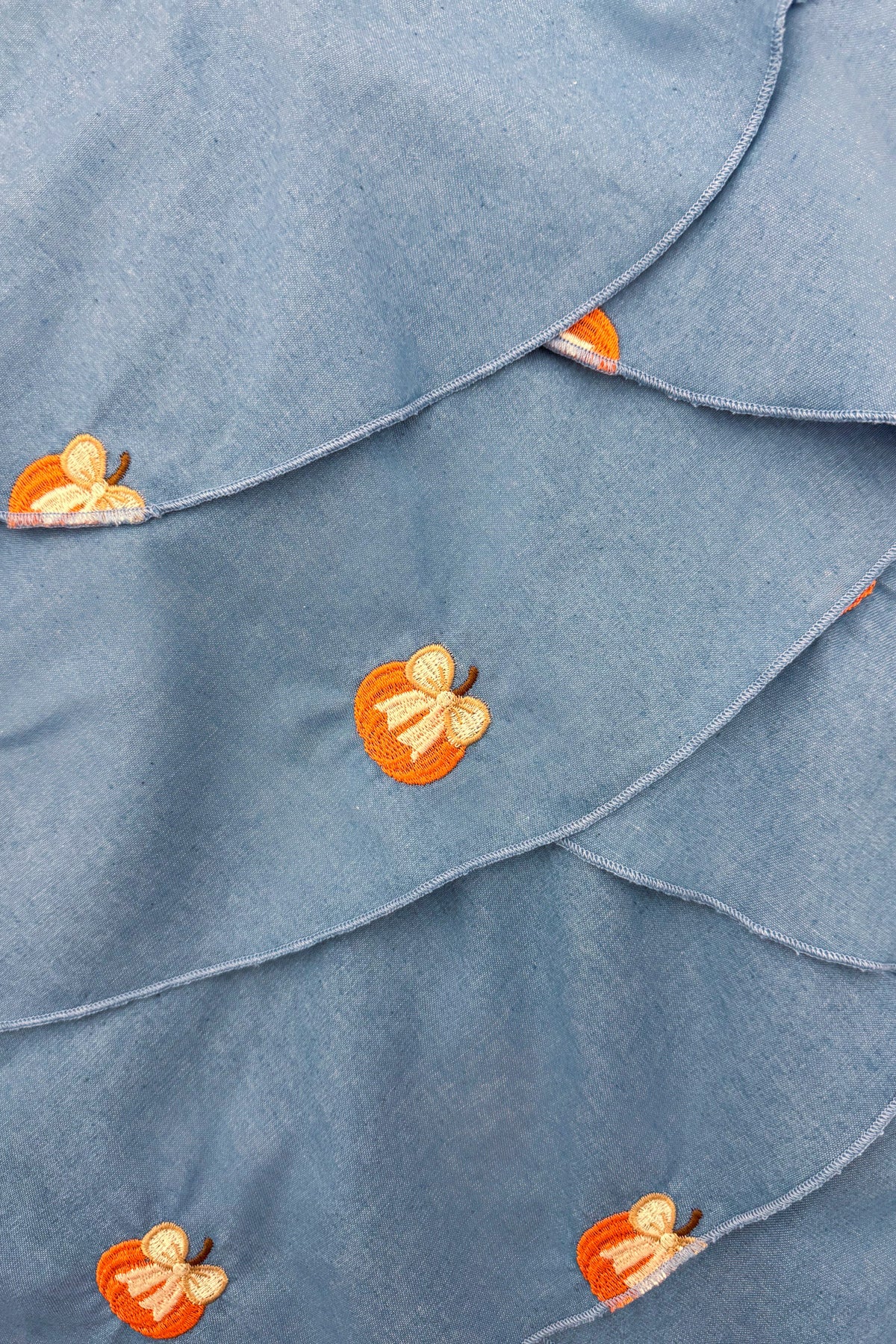 Chambray Pumpkin Maxi Dress - 6-12 Months - Blue chambray maxi dress with tiered ruffles and embroidered orange pumpkin accents.