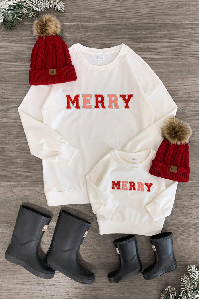 Mom & Me - "Merry" Chenille Patch Top - CHILD-3XS-6-12 Months - Cream chenille patch tops with "MERRY" in red lettering, paired with red knit pom-pom hats and black rain boots.