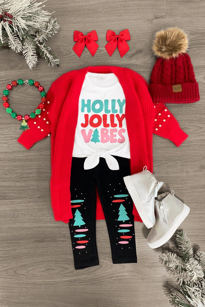 "Holly Jolly Vibes" Legging Set - 3XS-6-12 Months - Red long-sleeve bodysuit with "Holly Jolly Vibes" text, black leggings with Christmas trees, red bow clips, red knit pom-pom .