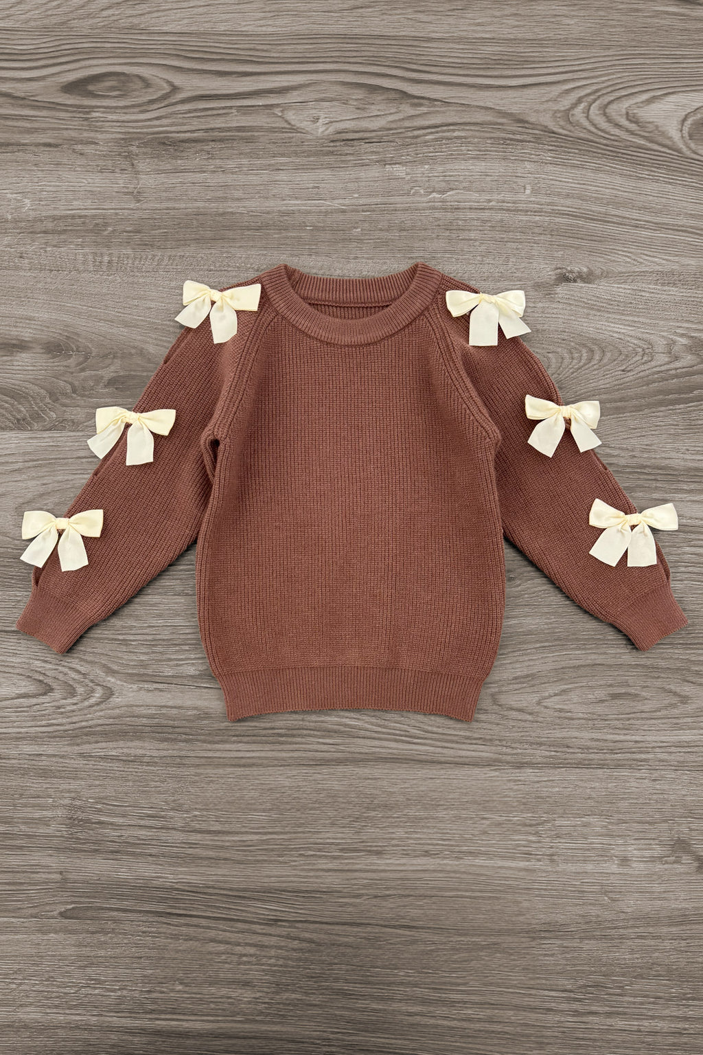 Brown Gemstone Denim Pant Set - 6-12 Months - Brown knit sweater with long sleeves featuring six cream bows along the arms.