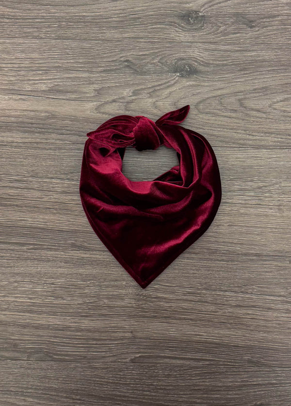 Green & Burgundy Velvet Family Pajamas - AND PET BANDANA! - PET-Burgundy Bandana-FAMILY - Burgundy velvet pet bandana with triangular shape and tied knot on wood floor background.