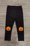 Jack O' Lantern Legging Set - 6-12 Months - Black leggings with bright orange jack-o'-lantern faces on the knees, stretchy fabric.