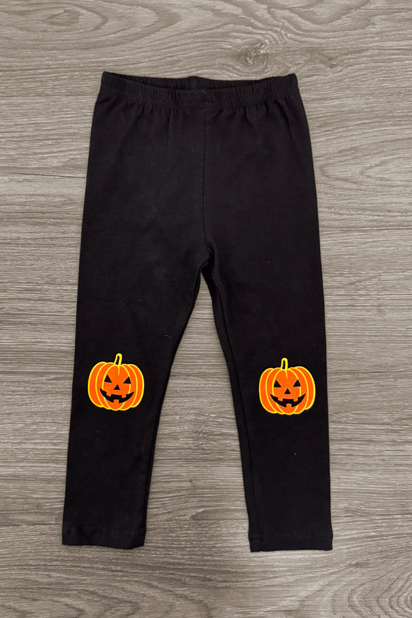 Jack O' Lantern Legging Set - 6-12 Months - Black leggings with bright orange jack-o'-lantern faces on the knees, stretchy fabric.