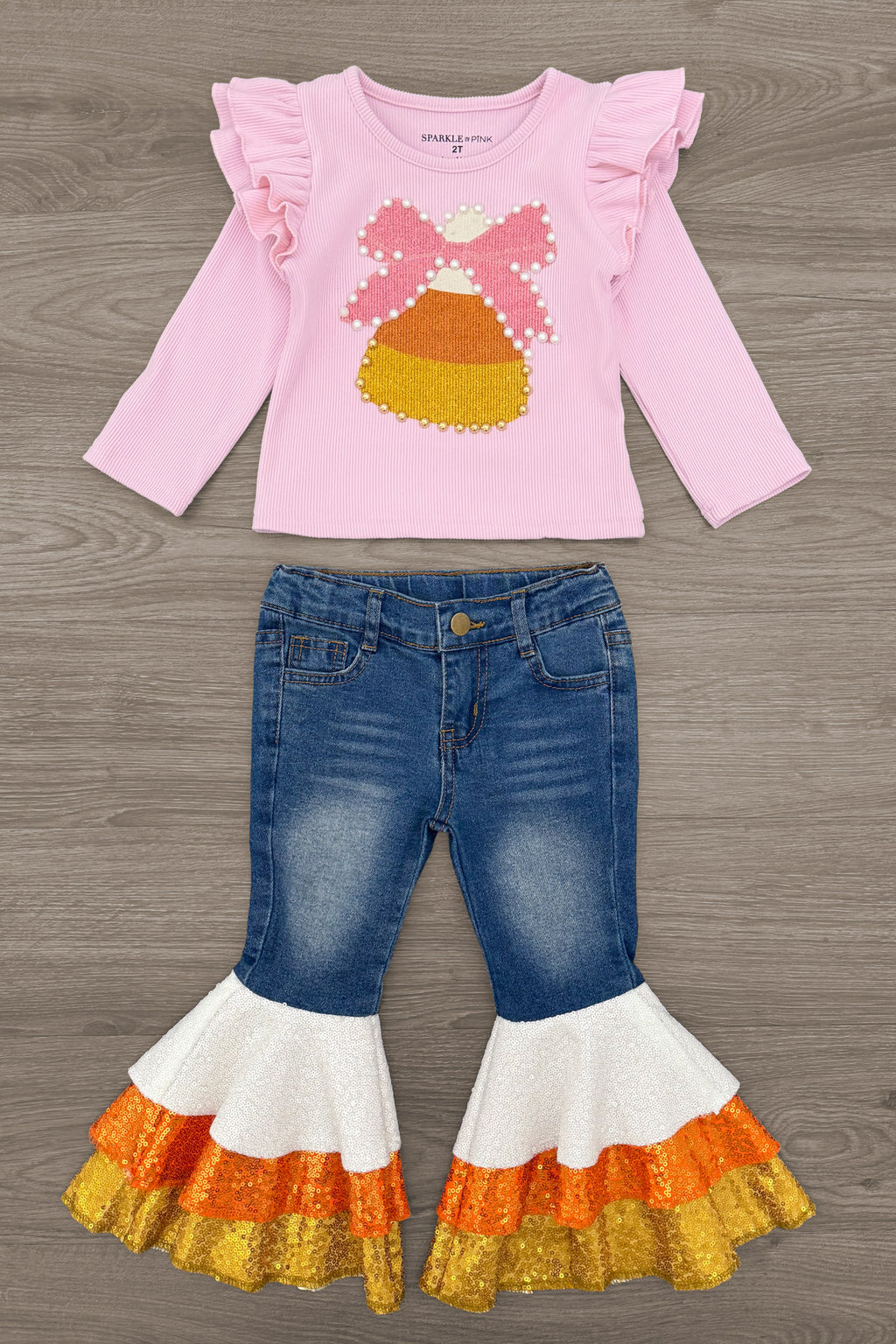 Candy Corn Bow Denim Bell Bottom Set - 6-12 Months - Pink long-sleeve top with ruffled shoulders and candy corn graphic paired with denim bell-bottom jeans featuring layered.