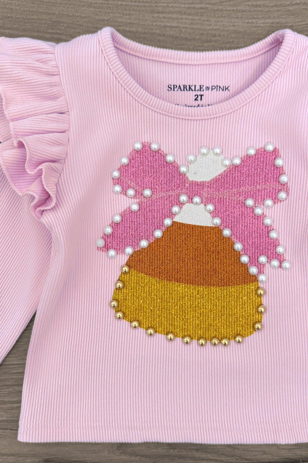 Candy Corn Bow Denim Bell Bottom Set - 6-12 Months - Pink long-sleeve top with ruffled shoulders and beaded candy corn bow applique.