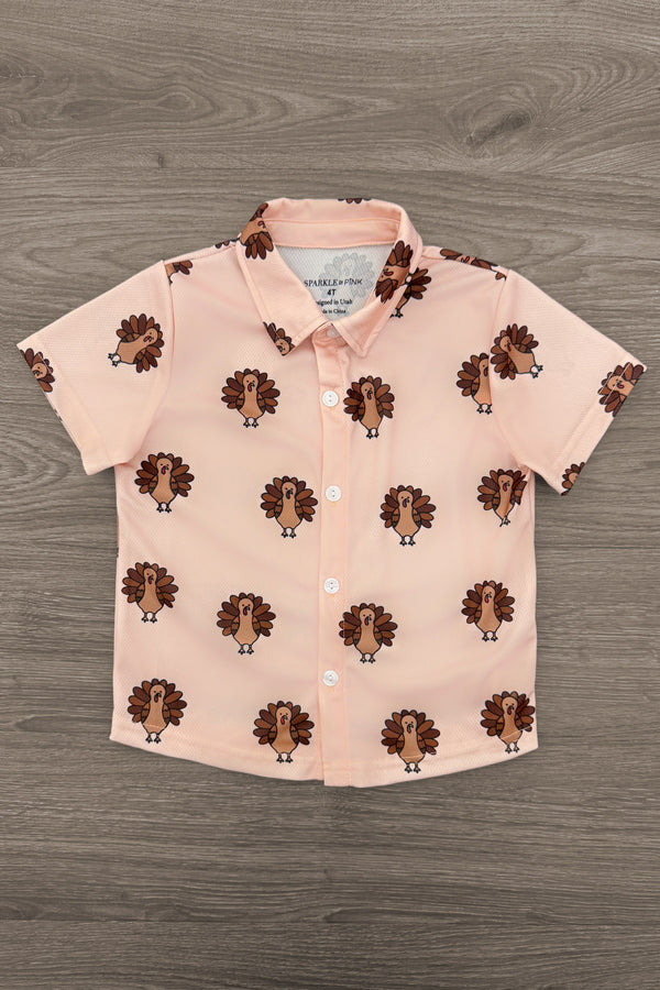 Turkey Button Down Top - 6-12 Months - Light peach short-sleeve button-down shirt with a collar and repeating turkey print.