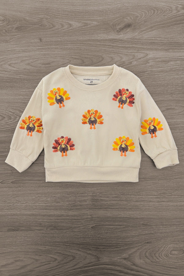Mom & Me - Corduroy Sequin Turkey Top - CHILD-6-12 Months - Cream long-sleeve sweatshirt with colorful sequin turkey appliqués across the front and sleeves.