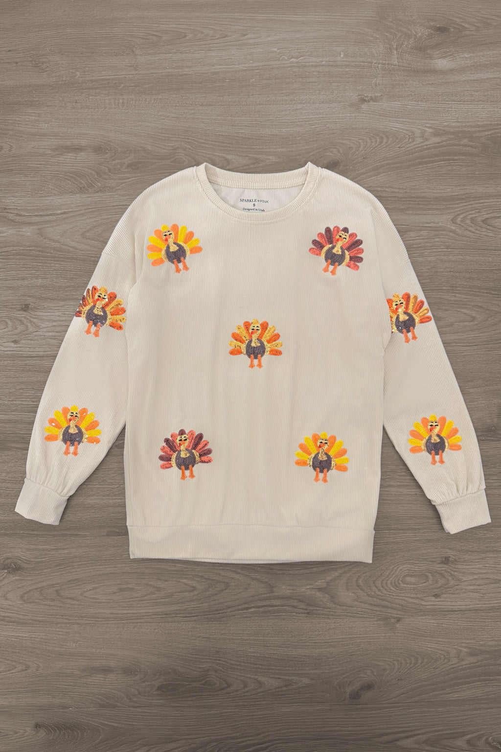 Mom & Me - Corduroy Sequin Turkey Top - MOM-XS - Cream long-sleeve top with colorful flower appliqués scattered across the front.