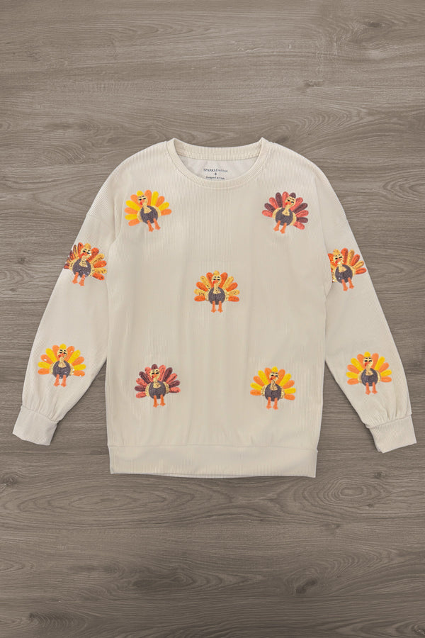 Mom & Me - Corduroy Sequin Turkey Top - MOM-XS - Cream long-sleeve top with colorful flower appliqués scattered across the front.