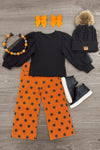Black & Orange Polka Dot Denim Pant Set - 6-12 Months - Black long-sleeve top with orange polka-dot wide-leg pants, paired with orange bows, beaded necklace, and black knit hat.