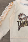 "Thankful" Cheetah Bow Pant Set - 6-12 Months - Cream-colored long-sleeve toddler shirt with ruffles on sleeves and cheetah print bow over "Thankful" text.