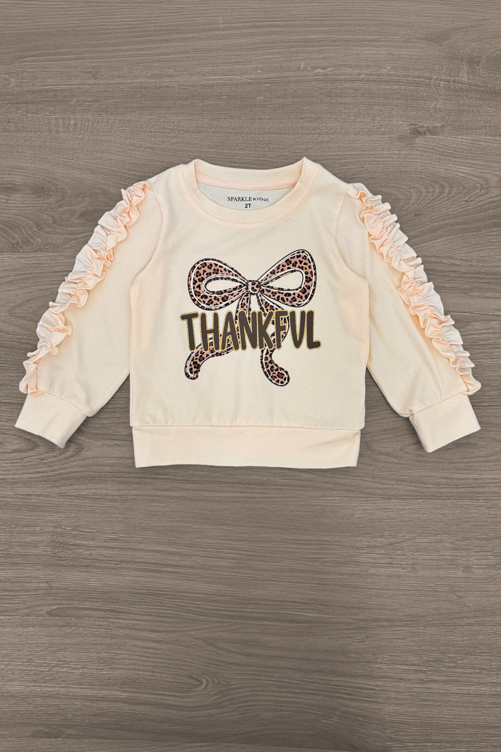 "Thankful" Cheetah Bow Pant Set - 6-12 Months - Cream long-sleeve toddler top with ruched sleeves and cheetah print bow, "THANKFUL" text front.