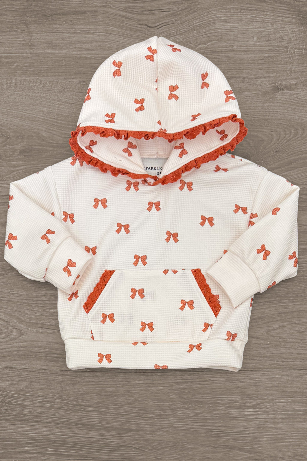 Mom & Me - Waffle Knit Bow Lounge Set - CHILD-6-12 Months - Cream waffle-knit baby hoodie with orange bow print, orange-lined hood, and front pockets.
