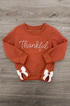 Mom & Me - "Thankful" Bow Pullover - CHILD-6-12 Months - Rust-orange pullover with "Thankful" script and white bow accents on cuffs.