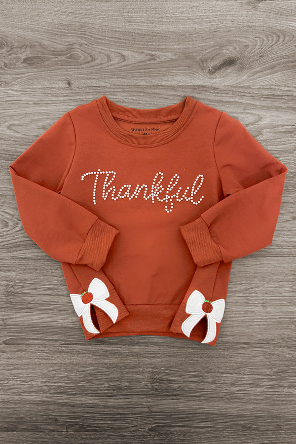 Mom & Me - "Thankful" Bow Pullover - CHILD-6-12 Months - Rust-orange pullover with "Thankful" script and white bow accents on cuffs.