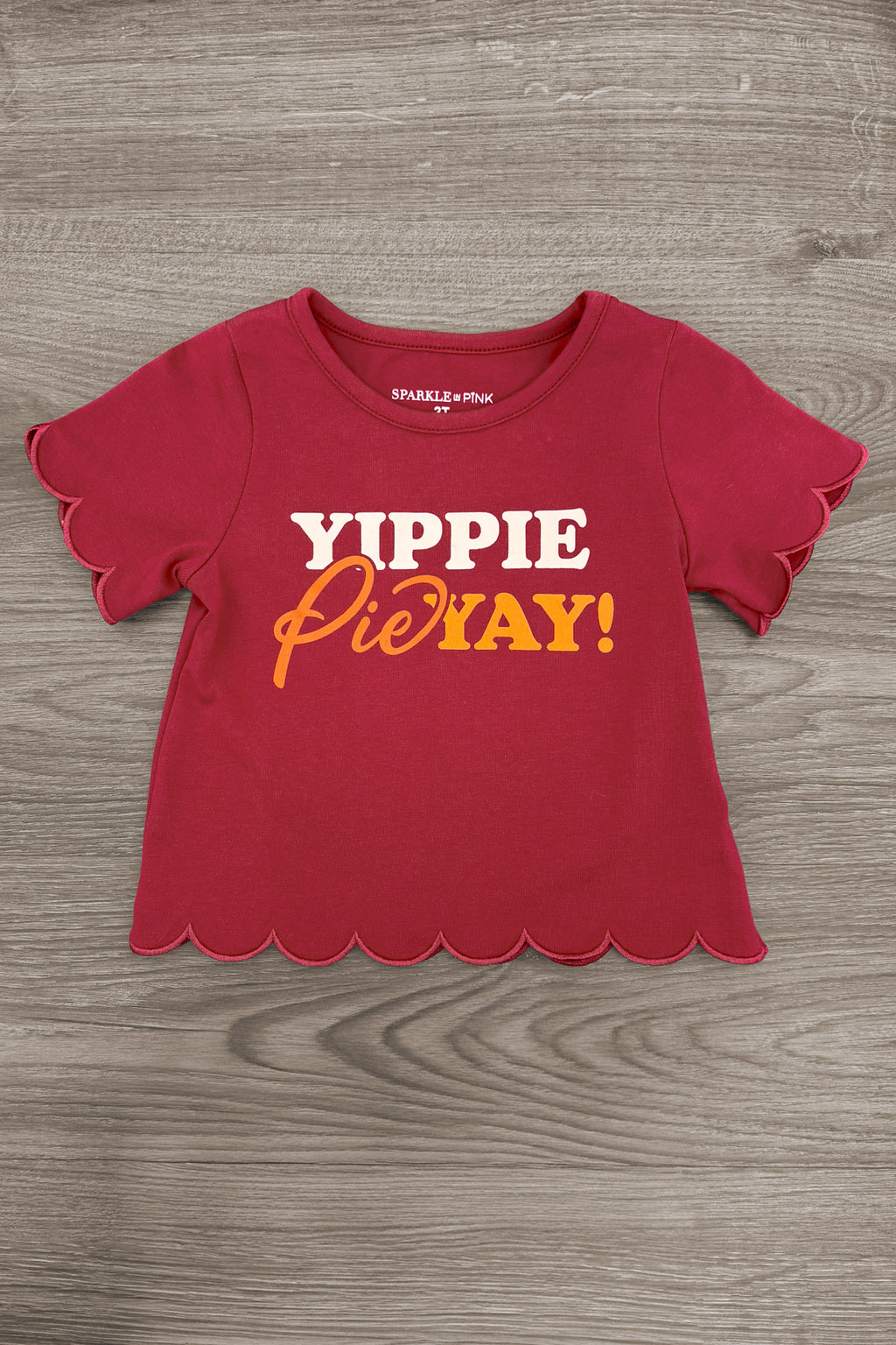 "Yippie Pie Yay!" Bell Bottom Pant Set - 6-12 Months - Burgundy-red short-sleeve top with scalloped edges and yellow “Yippie Pie Yay!” lettering.
