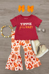 "Yippie Pie Yay!" Bell Bottom Pant Set - 6-12 Months - Burgundy graphic tee paired with white bell-bottom pants in a bold orange and red floral print.