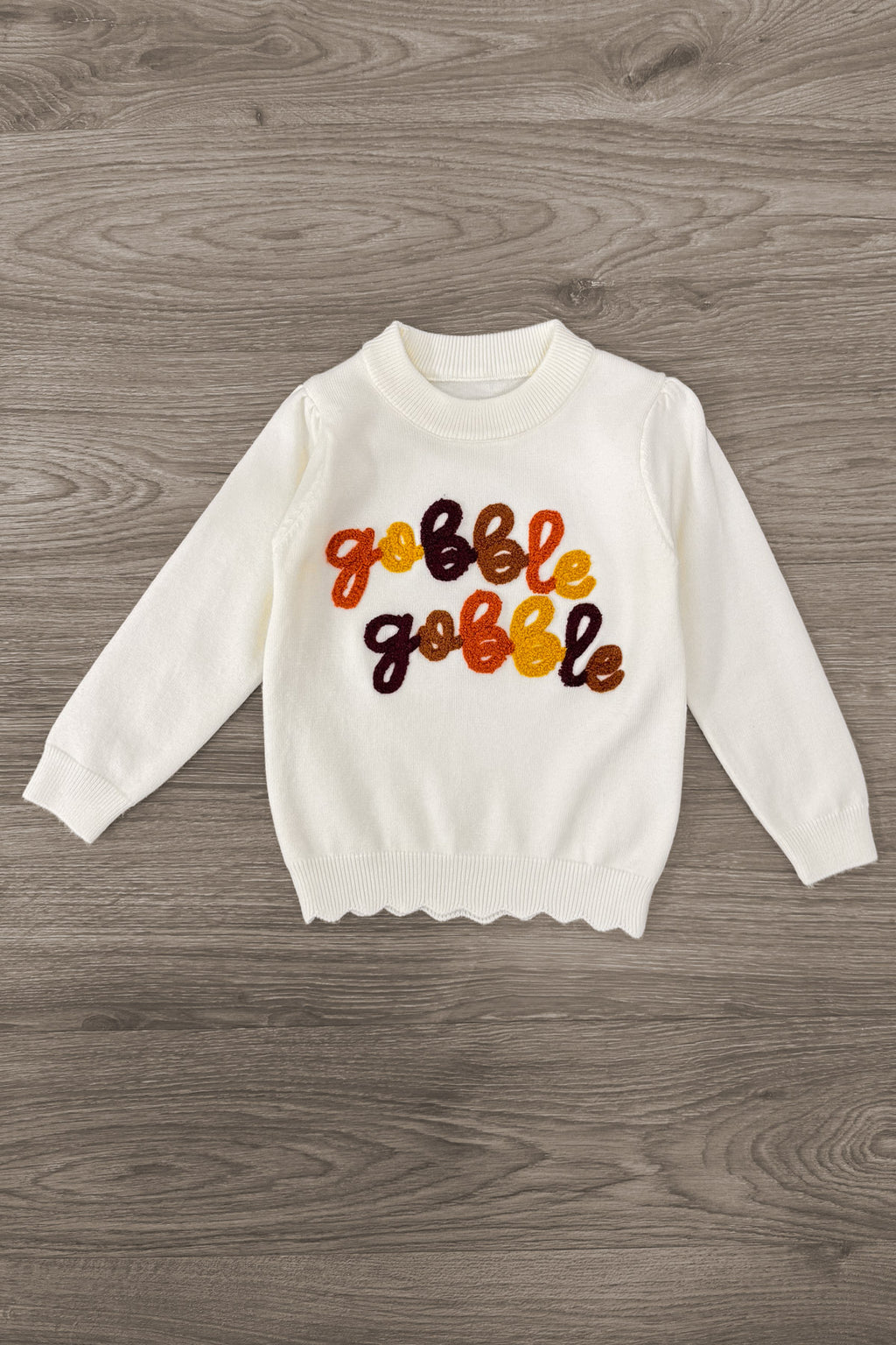 "Gobble Gobble" Pearl Flare Pant Set - 6-12 Months - Cream long-sleeve sweatshirt with colorful “Gobble Gobble” lettering and a scalloped hem.