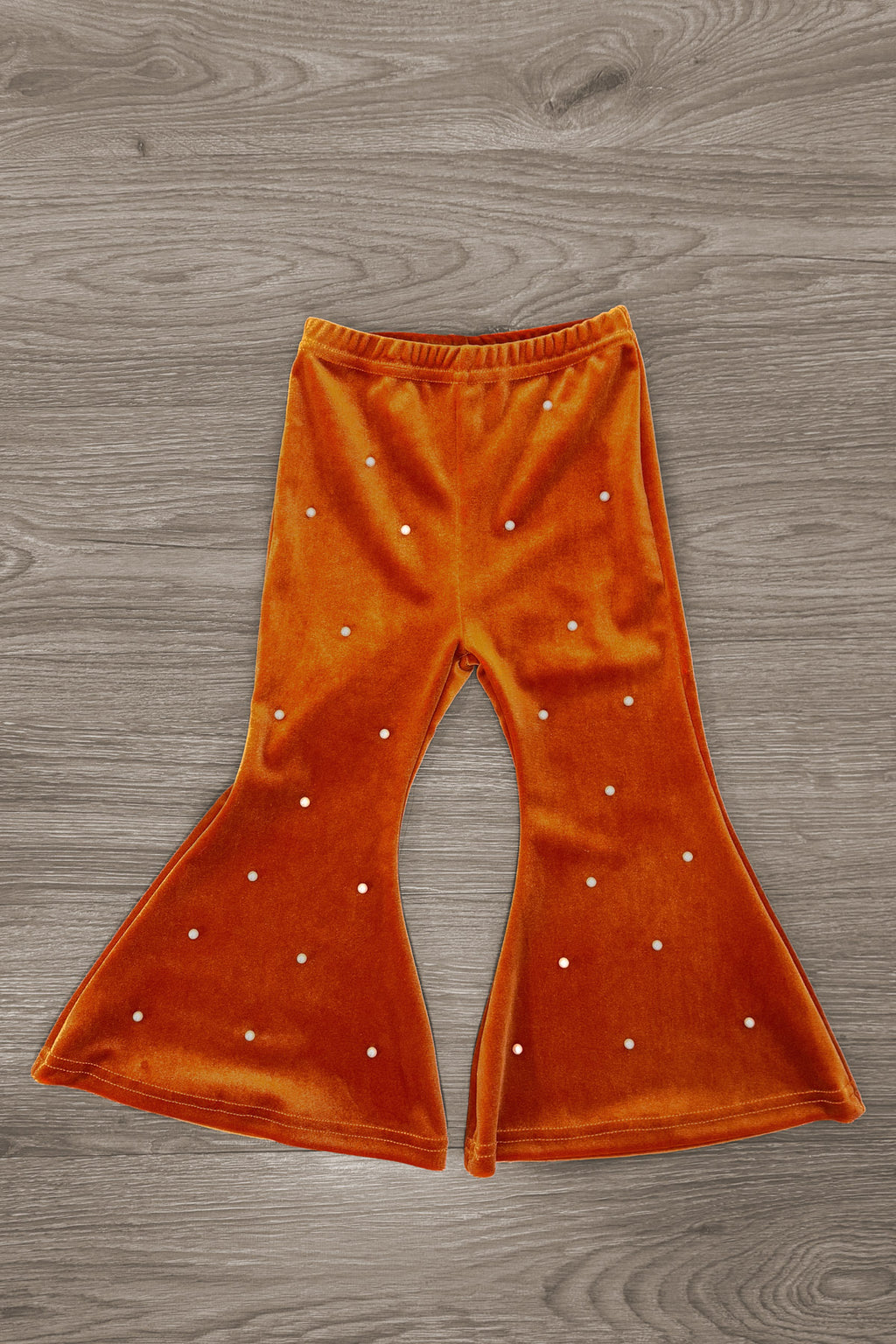"Gobble Gobble" Pearl Flare Pant Set - 6-12 Months - Rust-orange velvet flare pants with scattered pearl embellishments and an elastic waistband.